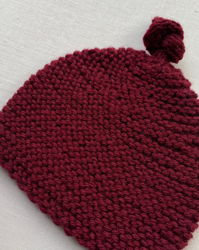Knitted by Nana Top Knot Beanie - Sangria