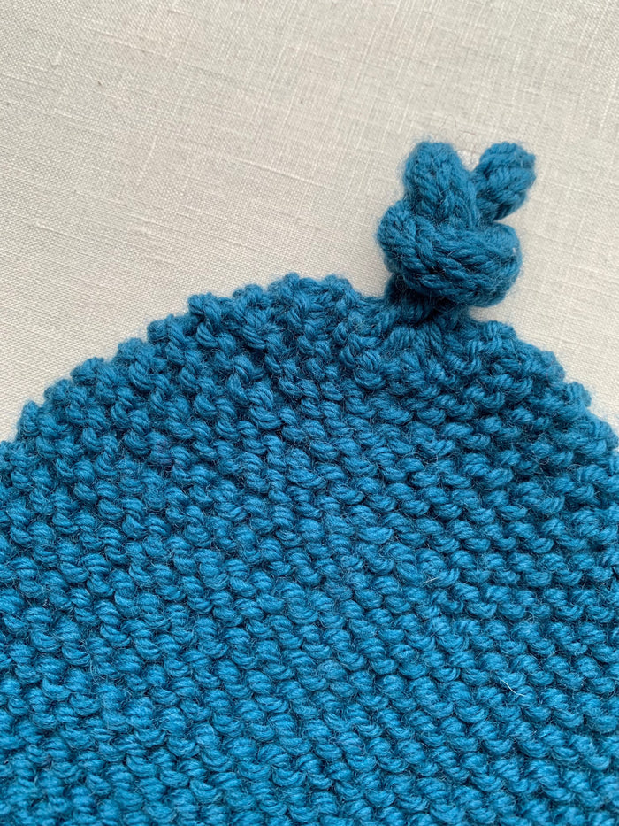Knitted by Nana Top Knot Beanie - Coastal Blue